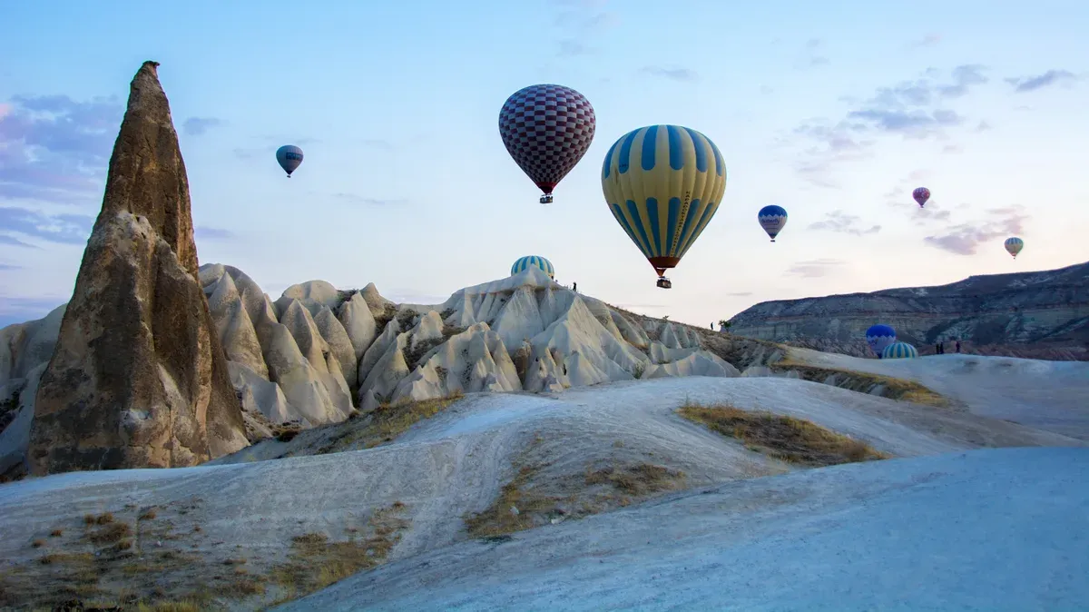 Balloons over the fairy chimneys of Goreme in Cappadocia, seen on Cappadocia tours from Istanbul