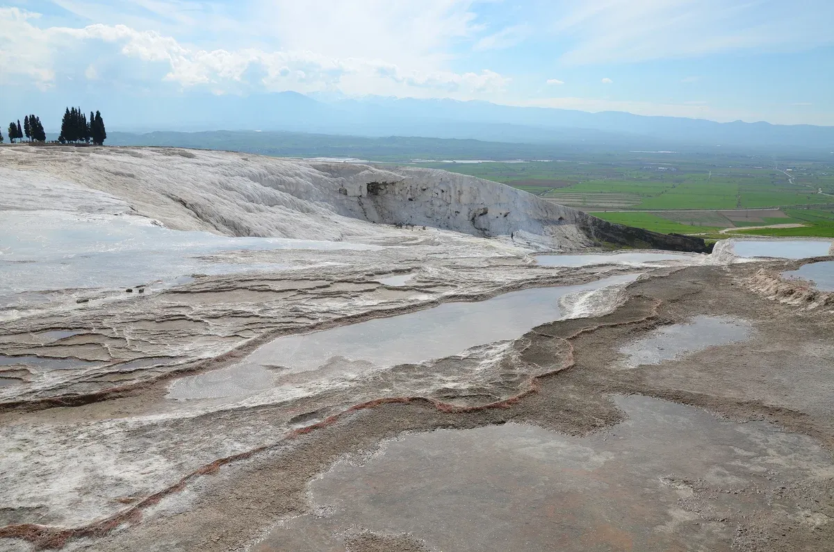Water on the white travertine terraces of Pamukkale, in a guide to the best time to visit Turkey